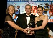 12 November 2005; Catherine O'Loughlin, from Clare, who was presented with her award by Ossie Kilkenny, Chairperson, of the Irish Sports Council and Miriam O'Callaghan, left, President, Cumann Camogaiochta na nGael, at the 2005 Camogie All-Star Awards, in association with O'Neills. Citywest Hotel, Dublin. Picture credit: Brendan Moran / SPORTSFILE