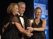 12 November 2005; Jovita Delaney, from Tipperary, who was presented with her award by Ossie Kilkenny, Chairperson, of the Irish Sports Council and Miriam O'Callaghan, left, President, Cumann Camogaiochta na nGael, at the 2005 Camogie All-Star Awards, in association with O'Neills. Citywest Hotel, Dublin. Picture credit: Ray McManus / SPORTSFILE