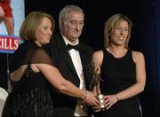 12 November 2005; Sinead Cahalan, from Galway, who was presented with her award by Ossie Kilkenny, Chairperson, of the Irish Sports Council and Miriam O'Callaghan, left, President, Cumann Camogaiochta na nGael, at the 2005 Camogie All-Star Awards, in association with O'Neills. Citywest Hotel, Dublin. Picture credit: Ray McManus / SPORTSFILE