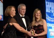 12 November 2005; Julie Kirwan, from Tipperary, who was presented with her award by Ossie Kilkenny, Chairperson, of the Irish Sports Council and Miriam O'Callaghan, left, President, Cumann Camogaiochta na nGael, at the 2005 Camogie All-Star Awards, in association with O'Neills. Citywest Hotel, Dublin. Picture credit: Ray McManus / SPORTSFILE