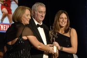 12 November 2005; Gemma O'Connor, from Cork, who was presented with her award by Ossie Kilkenny, Chairperson, of the Irish Sports Council and Miriam O'Callaghan, left, President, Cumann Camogaiochta na nGael, at the 2005 Camogie All-Star Awards, in association with O'Neills. Citywest Hotel, Dublin. Picture credit: Ray McManus / SPORTSFILE