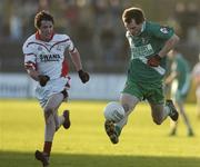 13 November 2005; Martin Dunne, Sarsfields, in action against Christy Bolger, Eire Og. Leinster Club Senior Football Championship Quarter-Final, Eire Og v Sarsfields, Dr. Cullen Park, Co. Carlow. Picture credit: Matt Browne / SPORTSFILE