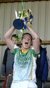 20 November 2005; Lisa McCrickard, Leitrim Fontenoys, Co Down, lifts the McBride Cup. All Ireland Junior Camogie Club Championship Final, Leitrim Fontenoys v Newmarket on Fergus, McDonagh Park, Cloughjordan, Co. Tipperary. Picture credit: Ray McManus / SPORTSFILE