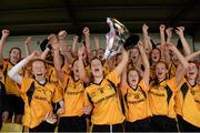 5 April 2014; Coláiste Íosagáin team captain Aedini Ni Dhonaill lifts the cup as her team-mates celebrate. TESCO HomeGrown Post Primary School Senior A Final, Coláiste Dún Iascaigh, Cahir v Coláiste Íosagáin, Stillorgan. Dr. Cullen Park, Carlow. Picture credit: Matt Browne / SPORTSFILE