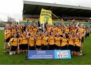 5 April 2014; Coláiste Íosagáin team captain Aedini Ni Dhonaill lifts the cup as her team-mates celebrate. TESCO HomeGrown Post Primary School Senior A Final, Coláiste Dún Iascaigh, Cahir v Coláiste Íosagáin, Stillorgan. Dr. Cullen Park, Carlow. Picture credit: Matt Browne / SPORTSFILE