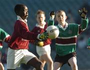 21 November 2005; Peter Ogbe, Scoil Maelruáin, in action against Thomas O'Rourke, St. Philip’s, Clonsilla, Old Bawn . Allianz Cumann na mBunscol Finals, Corn Mhic Chaoilte, Scoil Maelruáin, Old Bawn v St. Philip’s, Clonsilla, Croke Park, Dublin. Picture credit: David Levingstone / SPORTSFILE