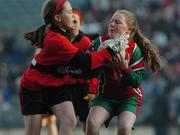 21 November 2005; Marie Hegarty, St. Brigid’s, Castleknock, in action against Eimear Duffy, Scoil Cholmcille, Knocklyon. Allianz Cumann na mBunscol Finals, Corn Austin Finn, St. Brigid’s, Castleknock v Scoil Cholmcille, Knocklyon, Croke Park, Dublin. Picture credit: David Levingstone / SPORTSFILE