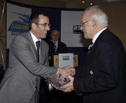 21 November 2005; The Association of Sports Journalists in Ireland, in association with Lucozade Sport, Ireland's leading sports drink, presented a celebration lunch to commemorate Ireland's famous win in the 1948 International Rugby Championship. At the lunch are Peter Harding,  Lucozade Sport, who presented Jimmy Nelson with his award. Jury's Hotel, Ballsbridge, Dublin. Picture credit: Ray McManus / SPORTSFILE