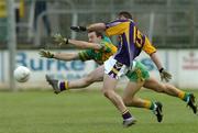 27 November 2005; Pat Burke, Kilmacud Crokes, in action against Roy Malone, Rhode. Leinster Club Senior Football Championship Semi-Final, Kilmacud Crokes v Rhode, St. Conleth's Park, Newbridge, Co. Kildare. Picture credit: David Maher / SPORTSFILE