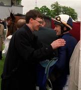 22 May 1999; Winning jockey Oliver Peslier is congratulated by trainer Aidan O'Brien after Saffron Waldon had won the 2,000 Guineas at The Curragh Racecourse in Kildare. Photo by Damien Eagers/Sportsfile