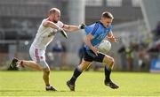 6 April 2014; Eoghan O'Gara, Dublin, has his jersey pulled by Tyrone's Danny McBride.  Allianz Football League, Division 1, Round 7, Tyrone v Dublin, Healy Park, Omagh, Co. Tyrone. Picture credit: Ray McManus / SPORTSFILE