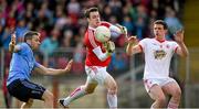 6 April 2014; Tyrone goalkeeper Niall Morgan, supported byAidan McCory, prepares to clear under pressure from Dublin forward Alan Brogan. Allianz Football League, Division 1, Round 7, Tyrone v Dublin, Healy Park, Omagh, Co. Tyrone. Picture credit: Ray McManus / SPORTSFILE