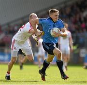 6 April 2014; Eoghan O'Gara, Dublin, has his jersey pulled by Tyrone's Danny McBride.  Allianz Football League, Division 1, Round 7, Tyrone v Dublin, Healy Park, Omagh, Co. Tyrone. Picture credit: Ray McManus / SPORTSFILE