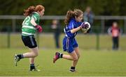 12 April 2014; Aoife Murray, Scoil Mhuire Carrick-On-Suir, in action against Sinéad Egan, Gallen CS Ferbane. Tesco HomeGrown Post Primary School Junior C, Gallen CS Ferbane, Co. Offaly v Scoil Mhuire Carrick-On-Suir, Co. Tipperary. Crettyard GAA, Crettyard, Co. Laois. Picture credit: Barry Cregg / SPORTSFILE