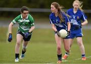 12 April 2014; Áine Power, Scoil Mhuire Carrick-On-Suir, in action against Kaitlin Rigney, Gallen CS Ferbane. Tesco HomeGrown Post Primary School Junior C, Gallen CS Ferbane, Co. Offaly v Scoil Mhuire Carrick-On-Suir, Co. Tipperary. Crettyard GAA, Crettyard, Co. Laois. Picture credit: Barry Cregg / SPORTSFILE