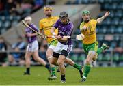 13 April 2014; Ross McGarry, Fingal, in action against Enda McDermott and Paddy Hannihan, Donegal. Allianz Hurling League Roinn 2B 2014 Promotion / Relegation Final, Fingal v Donegal, Kingspan Breffni Park, Cavan. Picture credit: Oliver McVeigh / SPORTSFILE