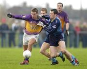 15 January 2006; Denis Bastick, Dublin, in action against Redmond Barry, Wexford. O'Byrne Cup, Second Round, Dublin v Wexford, O'Toole's GAA Club, Ayrefield Park, Coolock, Dublin. Picture credit: Brian Lawless / SPORTSFILE