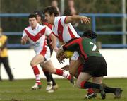 22 January 2006; Scott Moore, St. Helen's, is tackled by Nathan Meishke, London Skolars. Rugby League Exhibition Game, St. Helen's v London Skolars, Donnybrook, Dublin. Picture credit; Ciara Lyster / SPORTSFILE