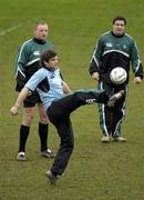 25 January 2006; Gordon D'Arcy practices his ball control while team-mates Mick O'Driscoll, left, and David Wallace, right, look on during Ireland rugby squad training. St Gerard's School, Bray, Co. Wicklow. Picture credit: Pat Murphy / SPORTSFILE