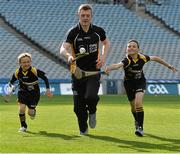 16 April 2014; Opel GAA ambassador Joe Canning, Galway, with Christian Finlay, right, age 10, and his  brother Derry, age 6, from Laytown, Co. Meath, at the launch of the Opel Kit for Clubs 2014. For every test drive, car service or Opel purchase made through the Opel dealer network, your local GAA club is awarded points that can be redeemed against high quality kit for your club! Log onto opelkitforclubs.com and start earning points today. Croke Park, Dublin. Picture credit: David Maher / SPORTSFILE