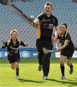 16 April 2014; Opel GAA ambassador Joe Canning, Galway, with Christian Finlay, right, age 10, and his  brother Derry, age 6, from Laytown, Co. Meath, at the launch of the Opel Kit for Clubs 2014. For every test drive, car service or Opel purchase made through the Opel dealer network, your local GAA club is awarded points that can be redeemed against high quality kit for your club! Log onto opelkitforclubs.com and start earning points today. Croke Park, Dublin. Picture credit: David Maher / SPORTSFILE