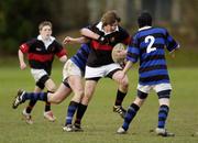 26 January 2006; Alex Conroy, High School, is tackled by Alex Denby, left, and Emmet Connolly, Mount Temple. Fr. Godfrey Junior Cup, High School v Mount Temple, Castleknock College, Castleknock, Dublin. Picture credit; Damien Eagers / SPORTSFILE