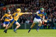 20 April 2014; James Woodcock, Tipperary, in action against Colm Galvin, Clare. Allianz Hurling League Division 1 semi-final, Clare v Tipperary, Gaelic Grounds, Limerick. Picture credit: Ray McManus / SPORTSFILE