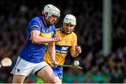 20 April 2014; Tipperary's Patrick Maher bursts past Clare's Cian Dillon to score his side's first goal of the game. Allianz Hurling League Division 1 semi-final, Clare v Tipperary, Gaelic Grounds, Limerick. Picture credit: Ray McManus / SPORTSFILE