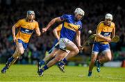 20 April 2014; Tipperary's Patrick Maher bursts past Clare's David McInerney, left, and Patrick O'Connor to score his side's first goal of the game. Allianz Hurling League Division 1 semi-final, Clare v Tipperary, Gaelic Grounds, Limerick. Picture credit: Ray McManus / SPORTSFILE