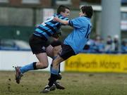 8 February 2006; Gavin McIntyre, Castleknock College, is tackled by David Hynes, St. Michael's College. Leinster Schools Junior Cup, St. Michael's College v Castleknock College, Donnybrook, Dublin. Picture credit; David Levingstone / SPORTSFILE