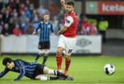 25 April 2014; James Chambers, St Patrick's Athletic, in action against Conor McMahon, Athlone Town. Airtricity League Premier Division, St Patrick's Athletic v Athlone Town, Richmond Park, Dublin. Picture credit: David Maher / SPORTSFILE