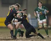 4 February 2006; Suzanne Fleming, Ireland, is tackled by Montserrat Poza and Ines Etxegibel, left, Spain. Women's Six Nations 2005-2006, Ireland v Spain, Donnybrook, Dublin. Picture credit; Brian Lawless / SPORTSFILE