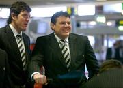 9 February 2006; Ireland prop Reggie Corrigan, alongside team-mate Shane Horgan, left, at Dublin Airport prior to the Ireland team's departure to Paris for the RBS 6 Nations game against France. Dublin Airport, Dublin. Picture credit; Brendan Moran / SPORTSFILE