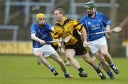 12 February 2006; Barry Coulter, Ballygalget, in action against Cathal Naughton, left, and Philip Noonan, Newtownshandrum. AIB All-Ireland Club Senior Hurling Championship Semi-Final, Newtownshandrum v Ballygalget, O'Moore Park, Portlaoise, Co. Laois. Picture credit: Brendan Moran / SPORTSFILE
