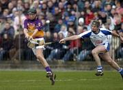 19 February 2006; MJ Furlong, Wexford, in action against Tom Feeney, Waterford. Allianz National Hurling League, Division 1A, Round 1, Waterford v Wexford, Dungarvan, Co. Waterford. Picture credit: Matt Browne / SPORTSFILE