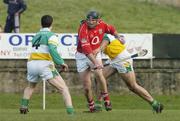 19 February 2006; Brian Corcoran, Cork, in action against David Franks, 4, and Paul Cleary, Offaly. Allianz National Hurling League, Division 1A, Round 1, Offaly v Cork, St. Brendan's Park, Birr, Co. Offaly. Picture credit: Pat Murphy / SPORTSFILE