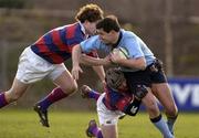 4 March 2006; Niall Kearns, UCD, is tackled by Breffnie O'Donnell and Marc Hewitt, left, Clontarf. AIB League 2005-2006, Division 1, UCD v Clontarf, Belfield Bowl, UCD, Dublin. Picture credit: Damien Eagers / SPORTSFILE
