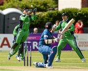 6 May 2014; Ireland wicketkeeper Gary Wilson catches the ball from Lahiru Thirimane, Sri Lanka, off the bowling of Alex Cusack. One Day International Cricket Match, Ireland v Sri Lanka, Castle Avenue, Clontarf, Co. Dublin. Picture credit: Oliver McVeigh / SPORTSFILE