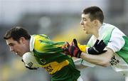 5 March 2006; Declan O'Sullivan, Kerry, holds off the challenge of Barry Owens, Fermanagh. Allianz National Football League, Division 1A, Round 3, Kerry v Fermanagh, Fitzgerald Stadium, Killarney, Co. Kerry. Picture credit: Brendan Moran / SPORTSFILE