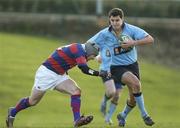 4 March 2006; Niall Kearns, UCD, is tackled by Breffnie O'Donnell, Clontarf. AIB League 2005-2006, Division 1, UCD v Clontarf, Belfield Bowl, UCD, Dublin. Picture credit: Damien Eagers / SPORTSFILE