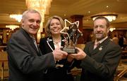 6 March 2006; GAA President Sean Kelly received a special merit award for outstanding service to the GAA. The award, a specially commissioned sculpture based on the All Stars theme, was presented by An Taoiseach Bertie Ahern TD and Vodafone Ireland’s CEO Teresa Elder. Westbury Hotel, Dublin. Picture credit: Ray McManus / SPORTSFILE