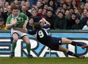 11 March 2006; Brian O'Driscoll, Ireland, is tackled by Mike Blair, Scotland. RBS 6 Nations 2005-2006, Ireland v Scotland, Lansdowne Road, Dublin. Picture credit: Brendan Moran / SPORTSFILE