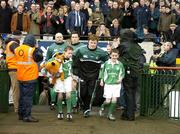 11 March 2006; Ireland captain Brian O'Driscoll and mascots Liam O'Dea and Daniel Trayers, lead the team out before the game. RBS 6 Nations 2005-2006, Ireland v Scotland, Lansdowne Road, Dublin. Picture credit: Brendan Moran / SPORTSFILE