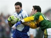 12 March 2006; Paul Finlay, Monaghan, is tackled by Declan O'Sullivan, Kerry. Allianz National Football League, Division 1A, Round 4, Monaghan v Kerry, St. Mary's Park, Scotstown, Co. Monaghan. Picture credit: Brendan Moran / SPORTSFILE