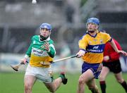 26 March 2006; Brian Carroll, Offaly, in action against Tommy Holland, Clare. Allianz National Hurling League, Division 1A, Round 4, Clare v Offaly, Cusack Park, Ennis, Co. Clare. Picture credit: Kieran Clancy / SPORTSFILE