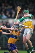 26 March 2006;   Joe Bergin, Offaly, in action against Gerry O'Grady, Clare. Allianz National Hurling League, Division 1A, Round 4, Clare v Offaly, Cusack Park, Ennis, Co. Clare. Picture credit: Kieran Clancy / SPORTSFILE