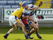 2 April 2006; Mark Rooney, Laois, is tackled by Eamonn Corcoran, Tipperary. Allianz National Hurling League, Division 1B, Round 5, Laois v Tipperary, O'Moore Park, Portlaoise, Co. Laois. Picture credit: Matt Browne / SPORTSFILE