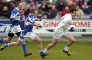 9 April 2006; Michael Foley, Kildare, in action against Ross Munnelly, Laois. Allianz National Football League, Division 1B, Round 7, Laois v Kildare, O'Moore Park, Portlaoise, Co. Laois. Picture credit: Brian Lawless / SPORTSFILE