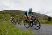22 May 2014; Tom Scully, Madison Gensis, on a descent to Glengarriff, Co. Cork, during Stage 5 of the 2014 An Post Rás. Cahirciveen - Clonakilty. Picture credit: Ramsey Cardy / SPORTSFILE