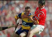 4 July 1999; Alan Markham of Clare in action against John Browne of Cork during the Munster Senior Hurling Championship Final match between Cork and Clare at Semple Stadium in Thurles, Tipperary. Photo by Brendan Moran/Sportsfile